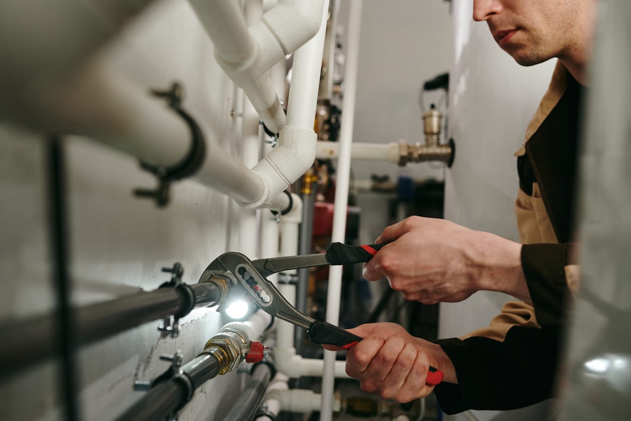 Plumbers maintaining commercial plumbing pipes in Wildwood
