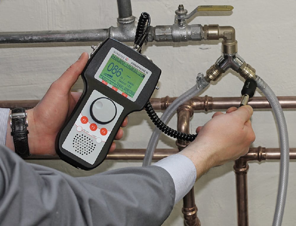 Plumber testing pipes with electronic leak detection equipment in Wildwood